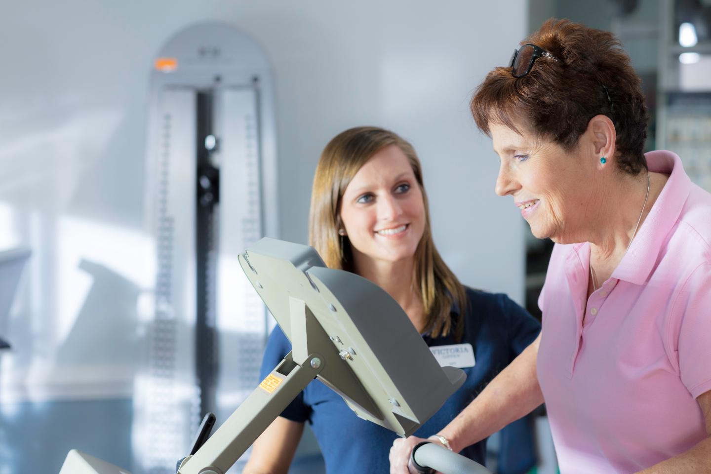 Ann with a therapist in our LifeWorks Rehab gym