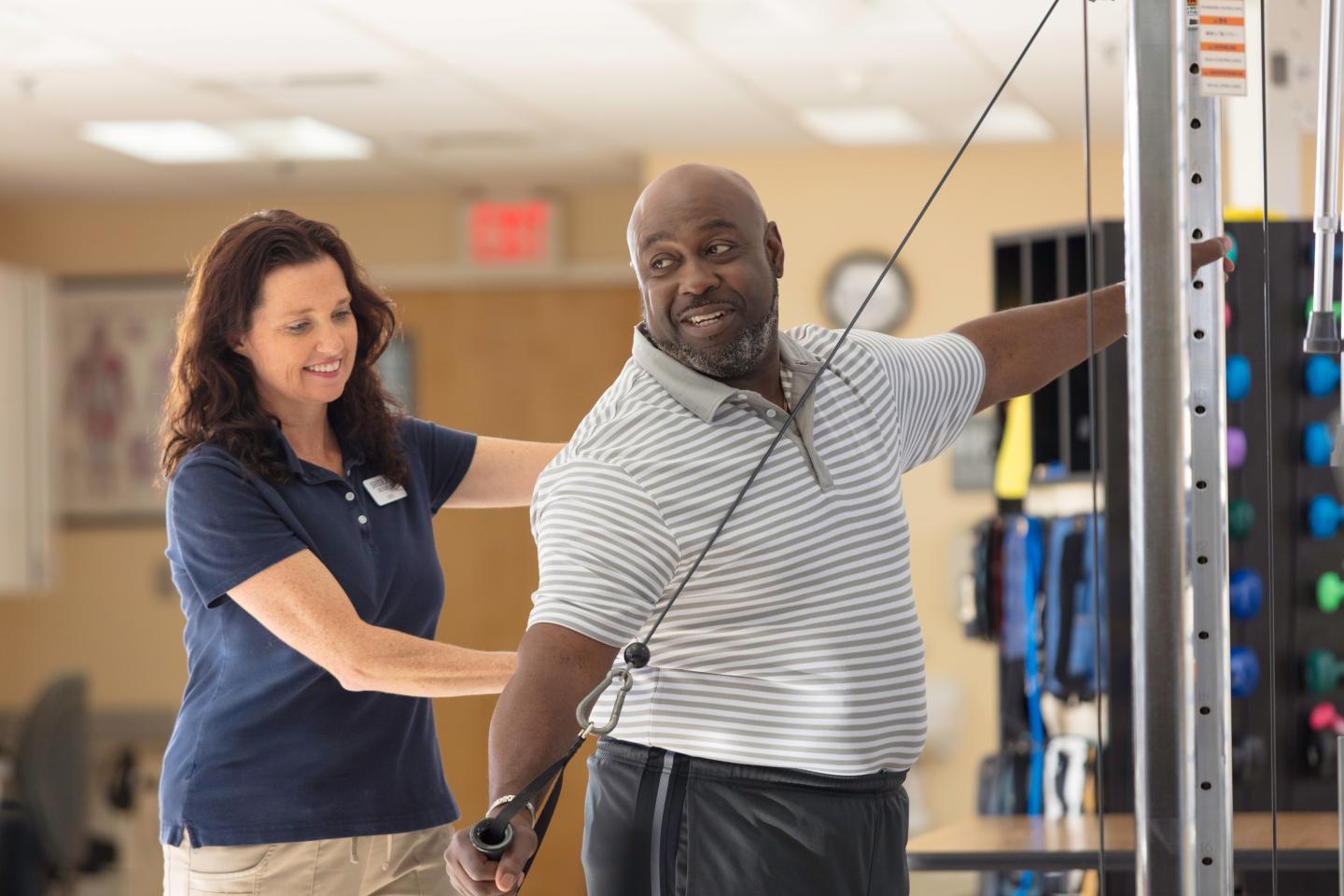 William doing therapy exercises with physical therapist.