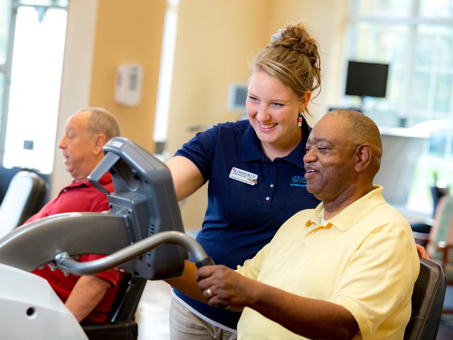 James and his therapists work in the gym. 