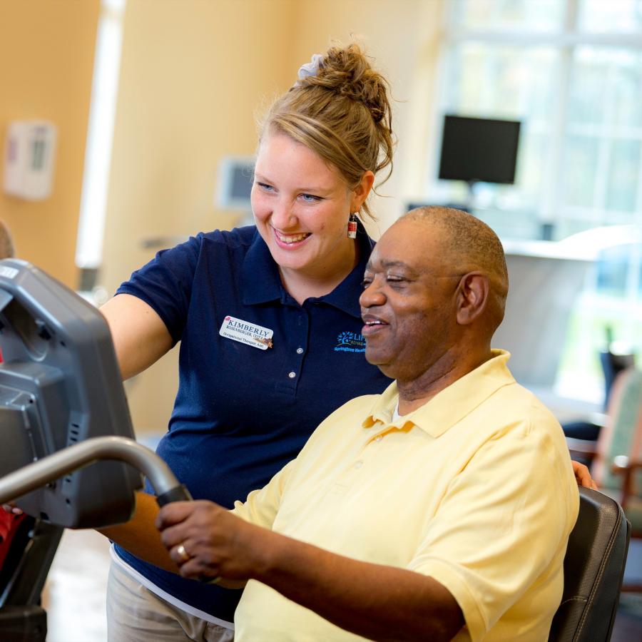 James and his therapists work in the gym. 
