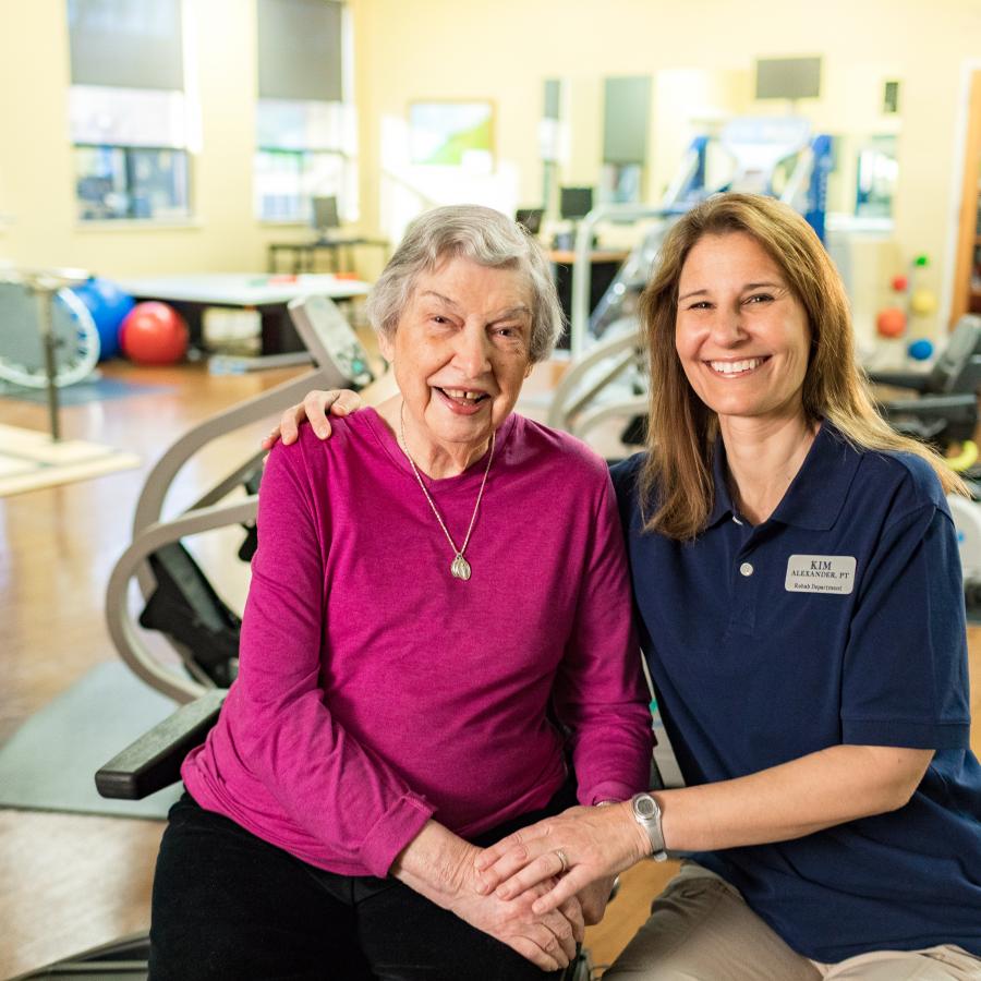 Yhome Murphy with a LifeWorks Rehab Therapist